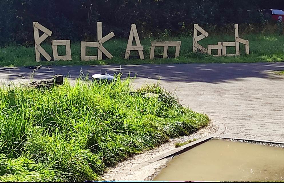 STAINLESS BLUE - Festival "Rock am Bach" , das Logo auf der Wiese